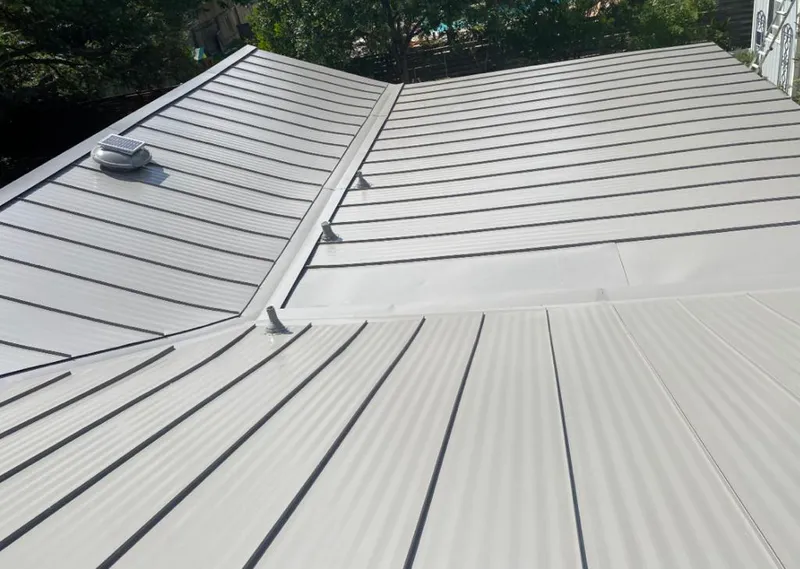 Solar attic fan installed on a metal roof for Roof Ventilation in South Portland